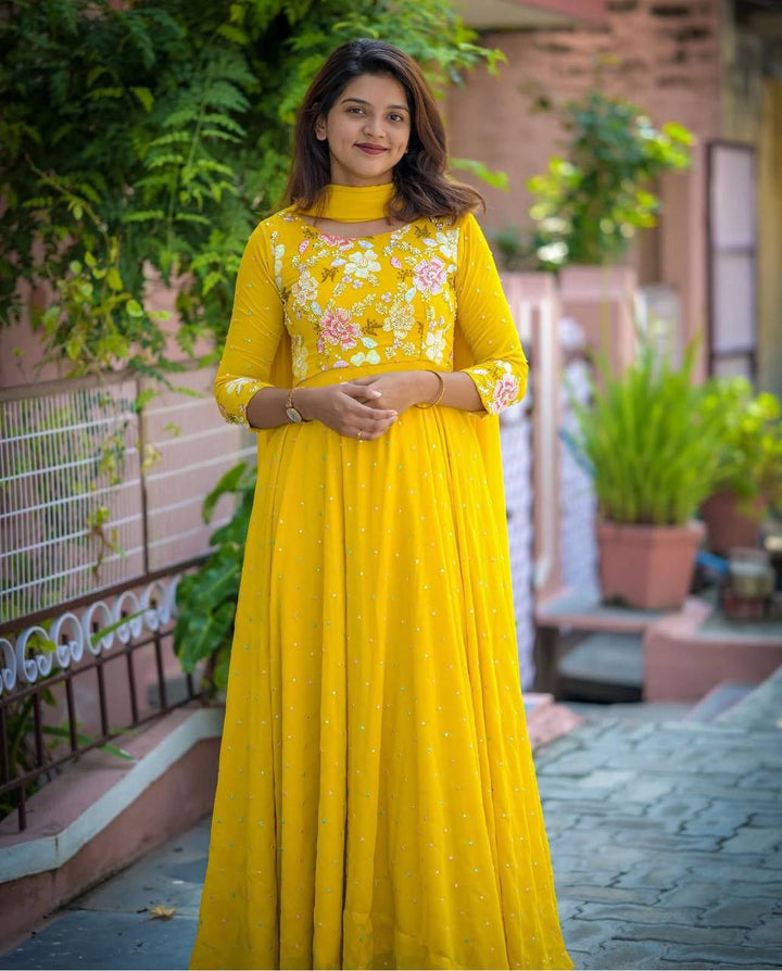 Attractive yellow Color Embrodiery Work Gown Collection