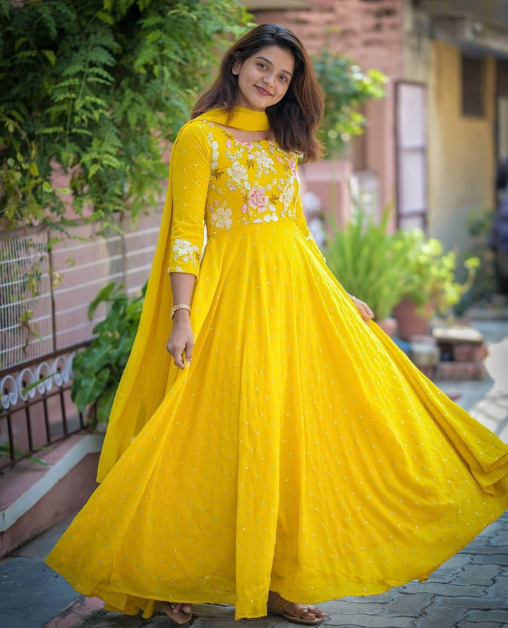 Attractive yellow Color Embrodiery Work Gown Collection